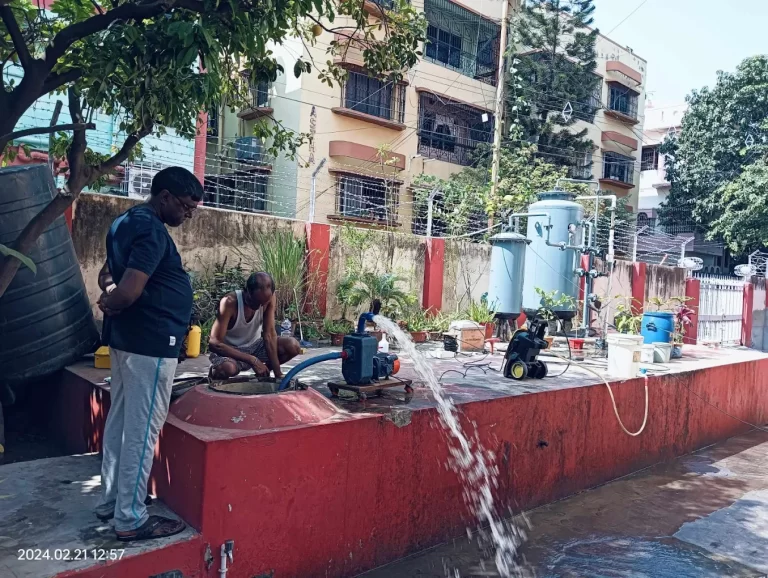 A. R. M. Solutions team cleaning a water tank setup